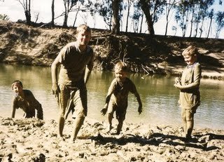 Camping Kids playing with mud